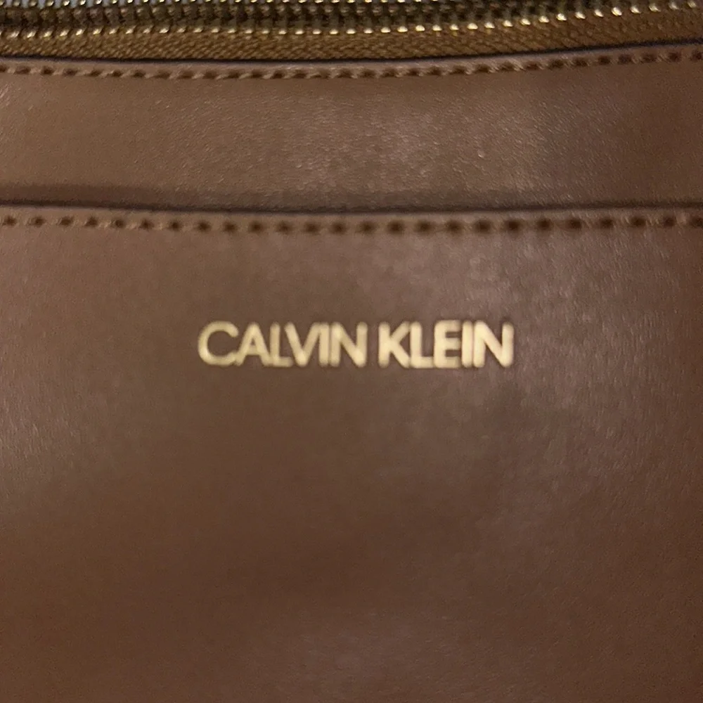 NWOT Calvin Klein camel color tan small bag can put wristlet has pocket in fron